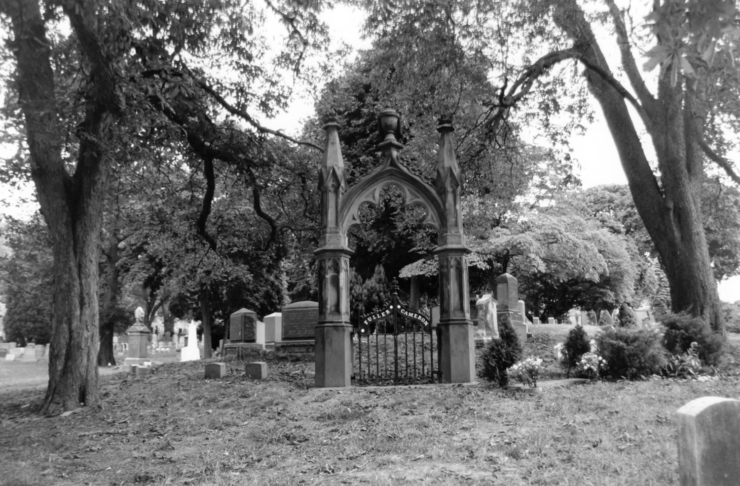 Green-Wood Cemetery-Greenwood, Brooklyn New York Brownstone Gothic Revival gate for the Fuller Cameron family lot with surrounding plantings near Oak and Lake Avenues (2005)