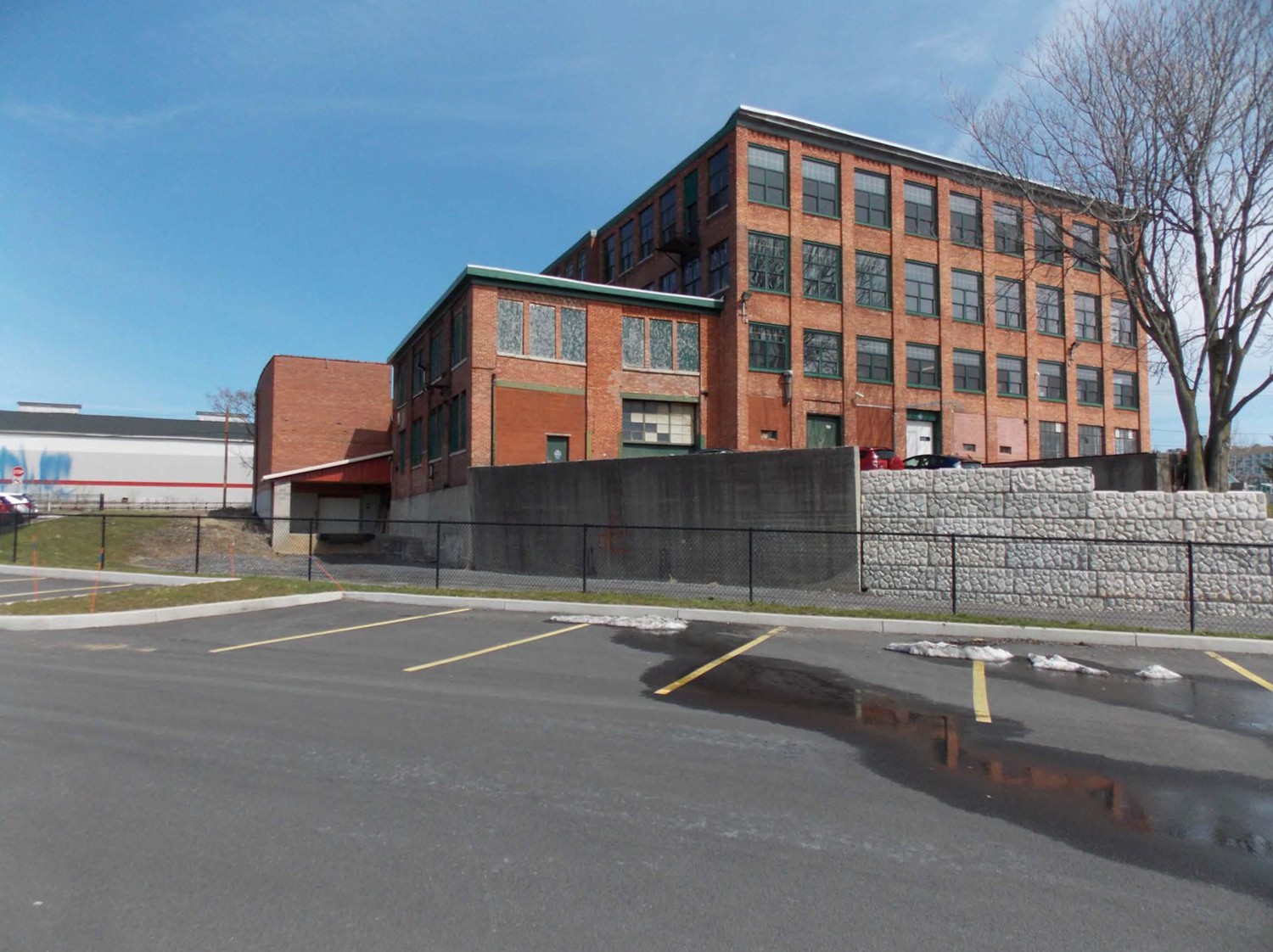 Oak Knitting Company, Syracuse New York West and north elevations, view looking southeast from adjacent parking lot (2016)