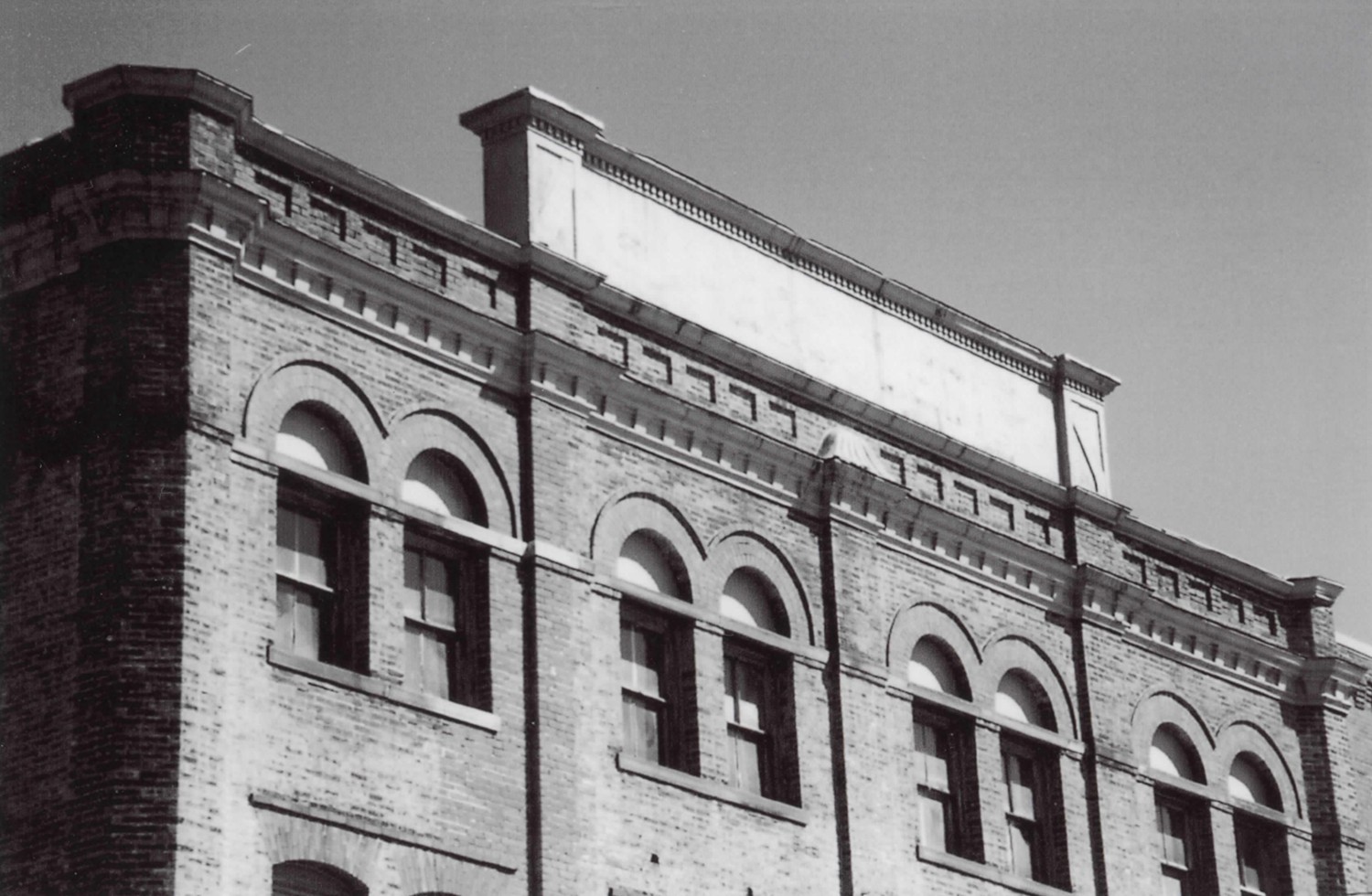 Born Capital Brewery Bottling Works - Hercules Trouser Company, Columbus Ohio Detail of west elevation showing decorative brickwork, cornice, parapet, and raised parapet signboard (2008)