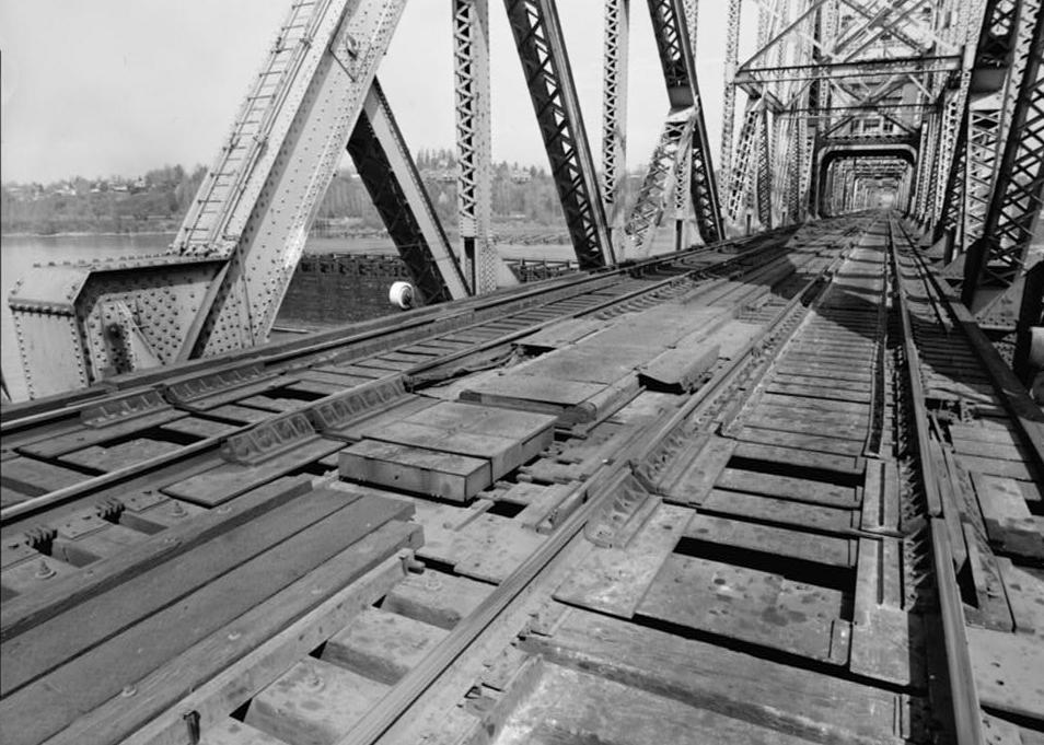 Willamette River Swing Truss Railroad Bridge, Portland Oregon 1985 VIEW OF SOUTH END OF DRAW SPAN IN CLOSED POSITION, RAILS LOCKED, SHORE BOXES CLOSED.