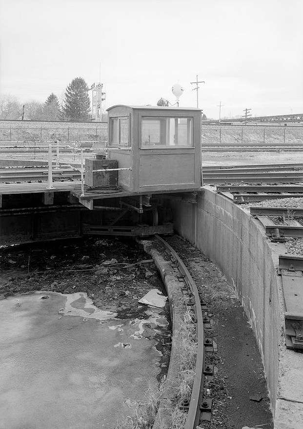 Bessemer & Lake Erie Railroad Maintenance Shops, Greenville Pennsylvania 2006 Detail of turntable pit, pit rail, and control cab. Sphere in background is a CB&I Watersphere water tower.