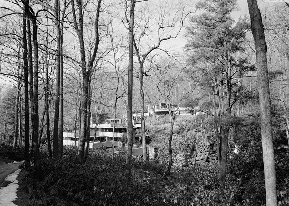 FallingWater - Frank Lloyd Wright House, Mill Run Pennsylvania VIEW FROM EAST OF HOUSE AND GUEST HOUSE [BACKGROUND]. THIS IS THE FIRST GLIMPSE OF THE HOUSE FROM THE DRIVEWAY, MOSTLY OBSCURED IN THE SUMMER.