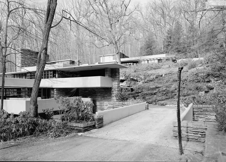 FallingWater - Frank Lloyd Wright House, Mill Run Pennsylvania VIEW FROM SOUTHEAST OF BRIDGE OVER BEAR RUN WITH HOUSE AND GUEST HOUSE IN BACKGROUND.