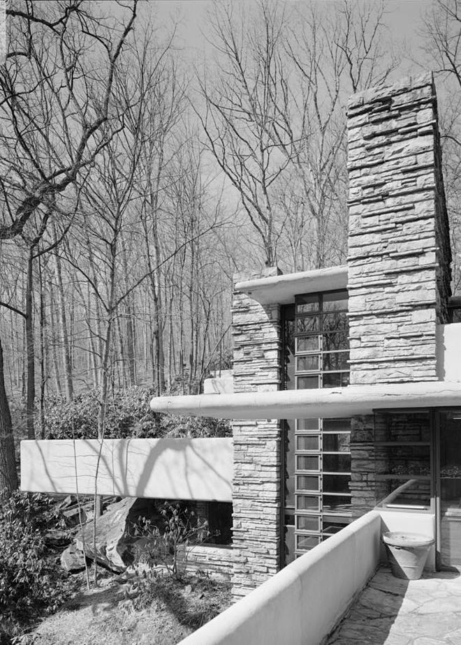 FallingWater - Frank Lloyd Wright House, Mill Run Pennsylvania WEST SIDE OF HOUSE WITH THREE-STORY WINDOW AND CHIMNEY FROM MASTER BEDROOM TERRACE.