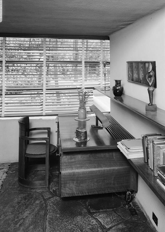 FallingWater - Frank Lloyd Wright House, Mill Run Pennsylvania SOUTHWEST CORNER OF GUEST BEDROOM SHOWING BUILT-IN WALNUT DESK AND FRANK LLOYD WRIGHT CIRCULAR CHAIR.