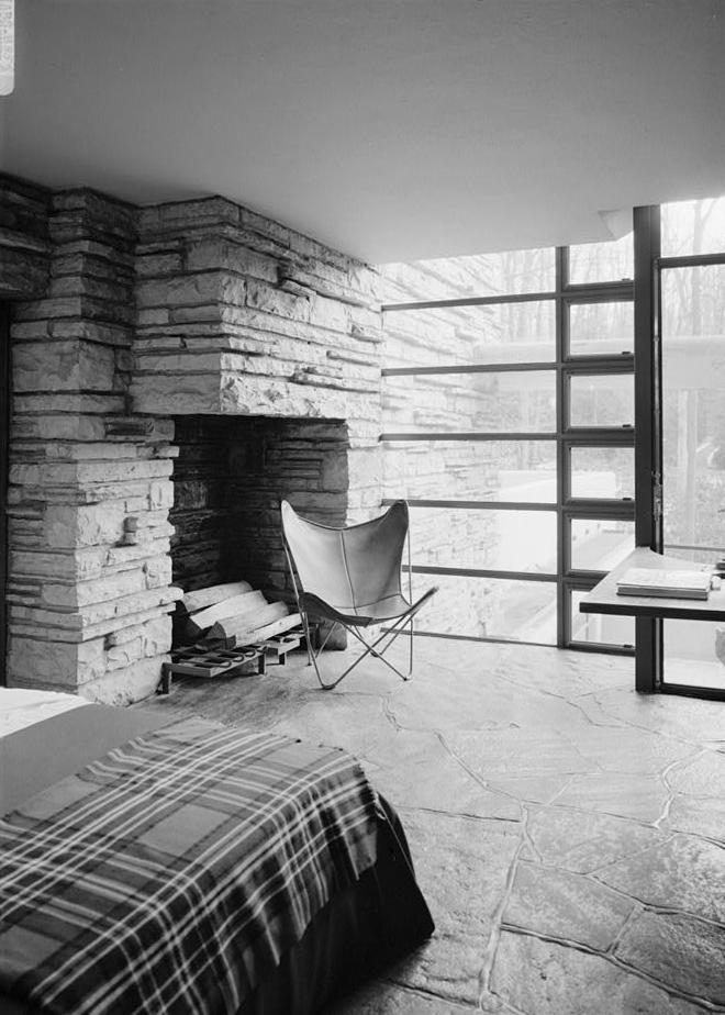 Falling Water - Frank Lloyd Wright House, Mill Run Pennsylvania DRESSING ROOM SHOWING STONE FIREPLACE AND FLOOR-TO-CEILING SOUTH WINDOWS. NOTE THE FRAMELESS JOINT BETWEEN THE WINDOW AND STONEWORK.