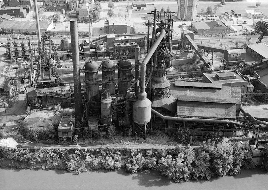 Pittsburgh Steel Company Monessen Works, Monessen Pennsylvania 1995 VIEW FACING EAST, VIEW FROM RIVER OF BLAST FURNACE NO. 3. DORR THICKENER & ORE BRIDGE AT LEFT, HOT BLAST STOVES & DUST CATCHER CENTER, CAST HOUSE AT RIGHT.