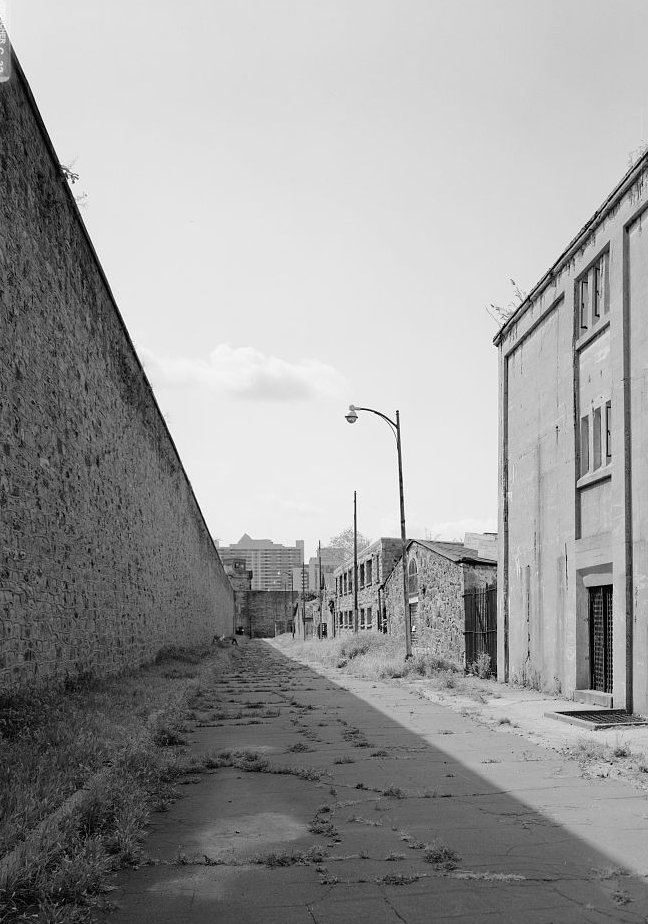 Eastern State Penitentiary, Philadelphia Pennsylvania General view of east yard, facing south (note from right to left: cell block fourteen, cell block eleven, cell block fifteen, cell block two, greenhouse, and cell block ten) (1998)