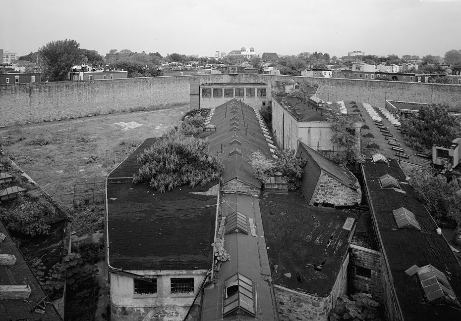 Eastern State Penitentiary, Philadelphia Pennsylvania Cell block three and northeast guard tower (center), looking from the central guard tower, facing northeast (note view also includes the baseball field (left), and cell blocks fourteen and eleven (right)) (1998)