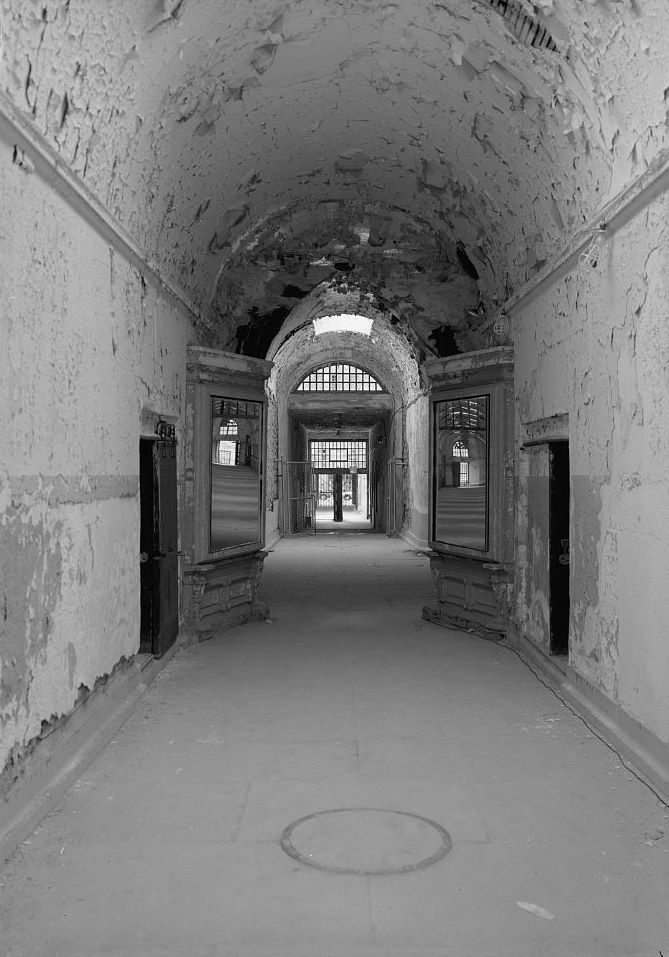 Eastern State Penitentiary, Philadelphia Pennsylvania Interior view, south corridor between the rotunda and cell blocks eight and nine, facing south (note cell blocks eight and nine reflected in mirrors) (1998)