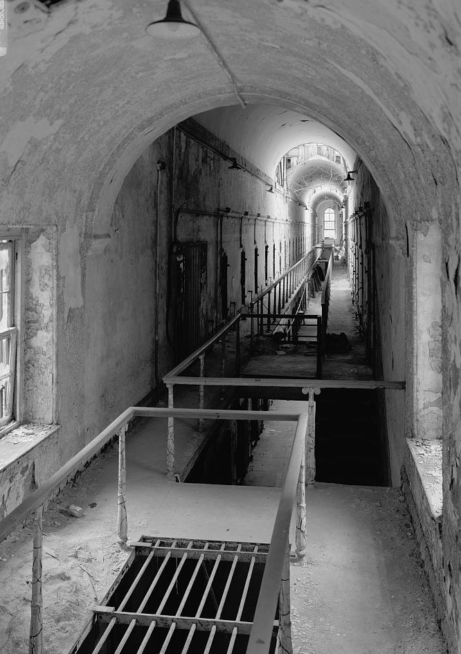 Eastern State Penitentiary, Philadelphia Pennsylvania Interior view, cell block six (note aeolic capitals on cast iron balusters, wood had rails on balcony) (1998)