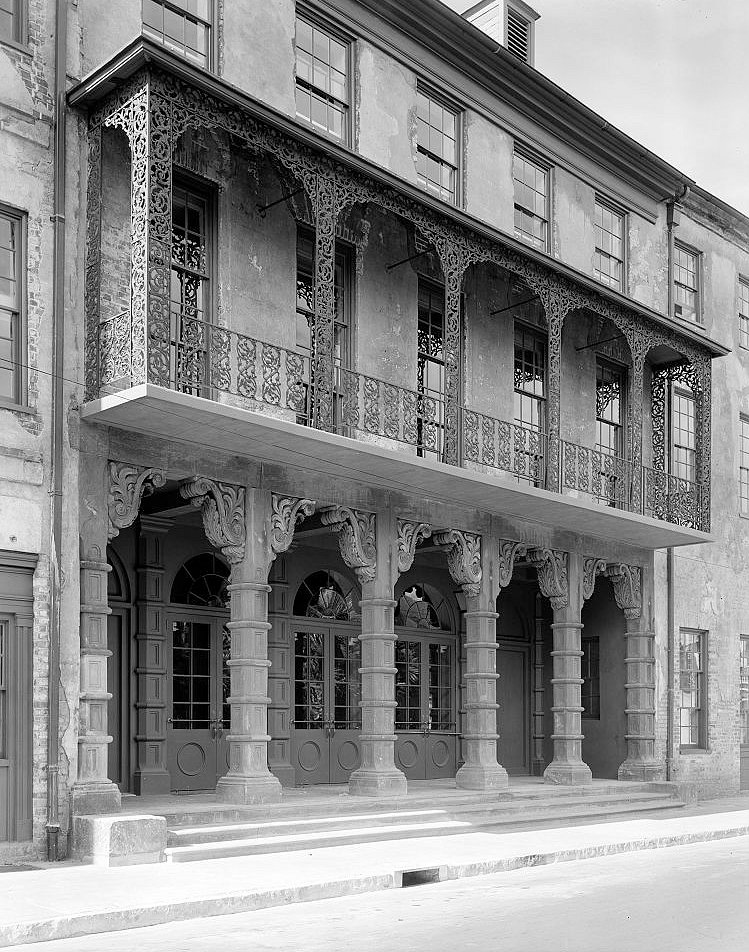 Columned porch, entrance openings and iron balcony - Dock Street Theatre, Charleston South Carolina