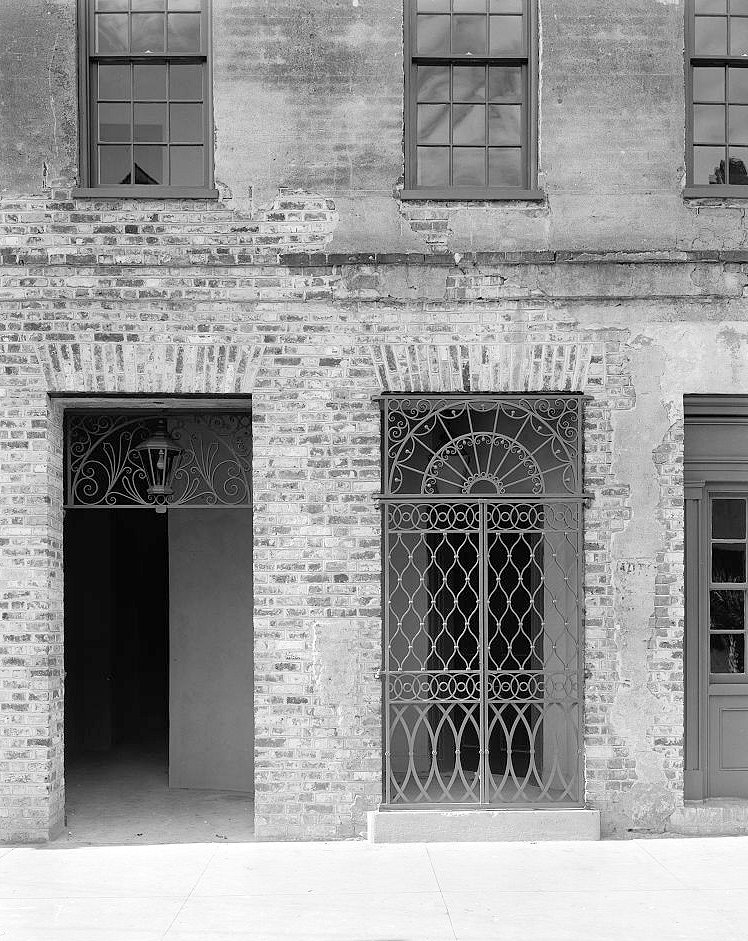Courtyard entrance gate and brick facade - Dock Street Theatre, Charleston South Carolina