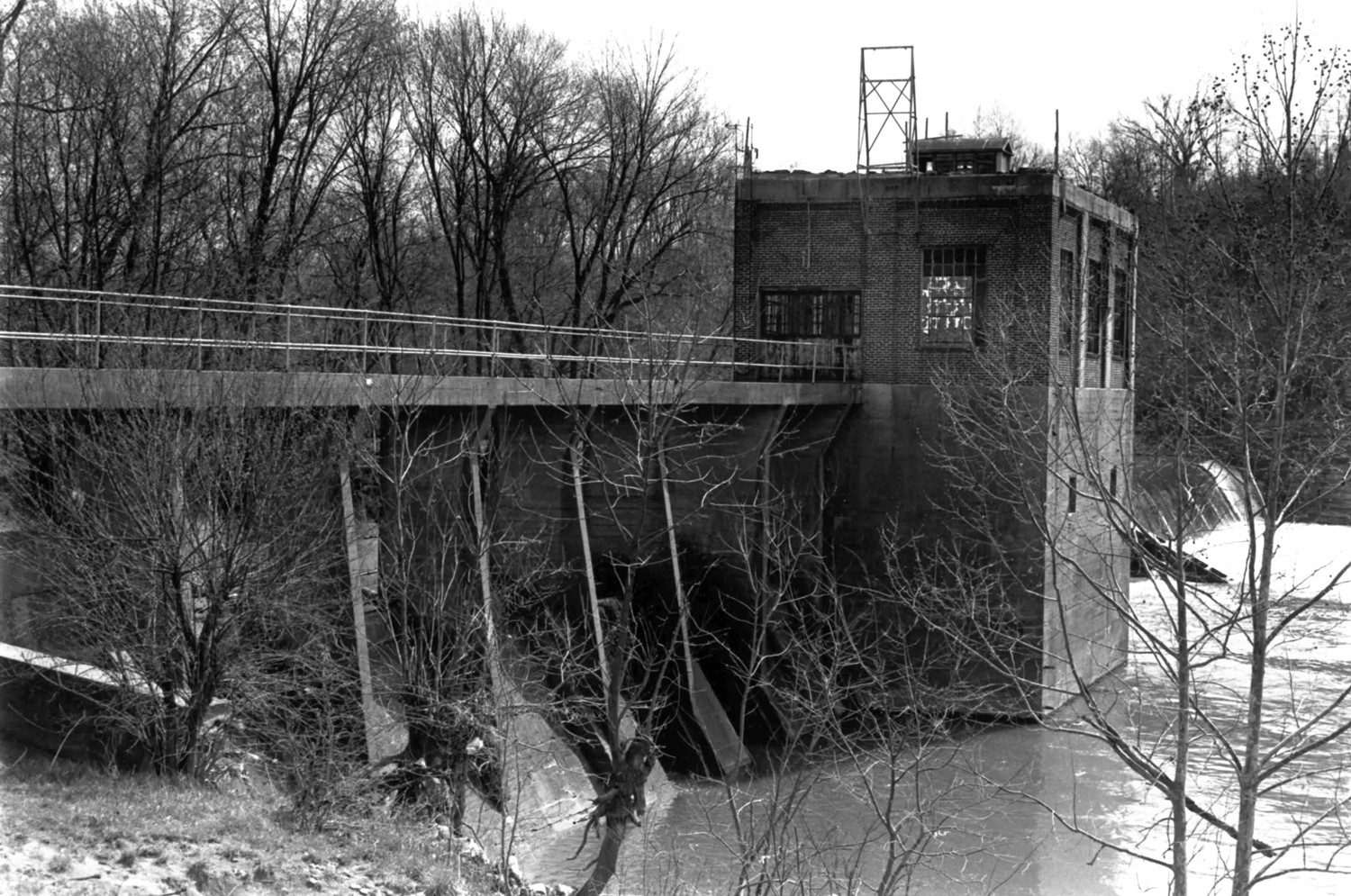 Columbia Hydroelectric Station, Columbia Tennessee Showing relationship to dam, walkway, and powerhouse. Fishladder visible just beyond powerhouse foundation. Looking West (1989)
