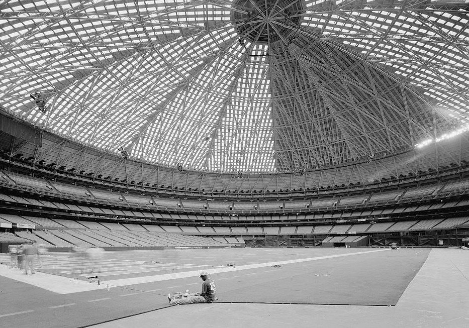 Houston Astrodome, Houston Texas 2004 LOOKING SOUTHWEST FROM FIELD LEVEL. WORKER IN FOREGROUND IS STITCHING TOGETHER ASTROTURF FOR FOOTBALL GAMES.