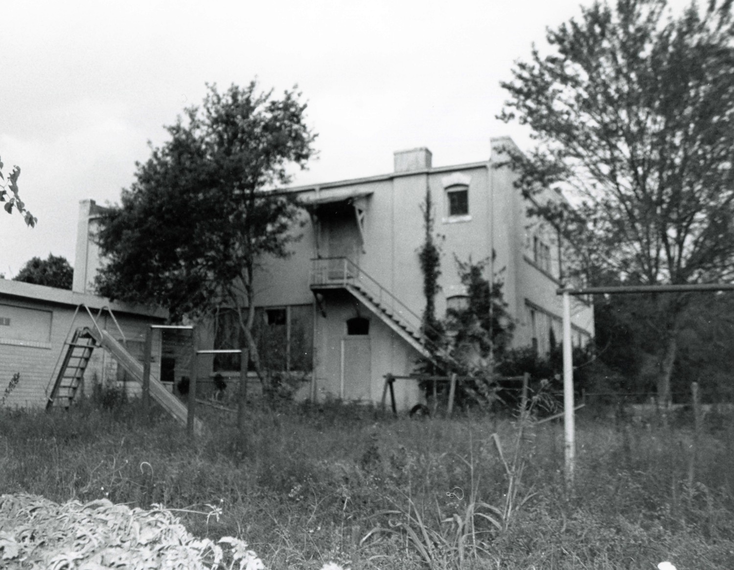 Lockhart Vocational High School - Carver High School, Lockhart Texas Back facade and restroom building, and playground camera facing north (1997)