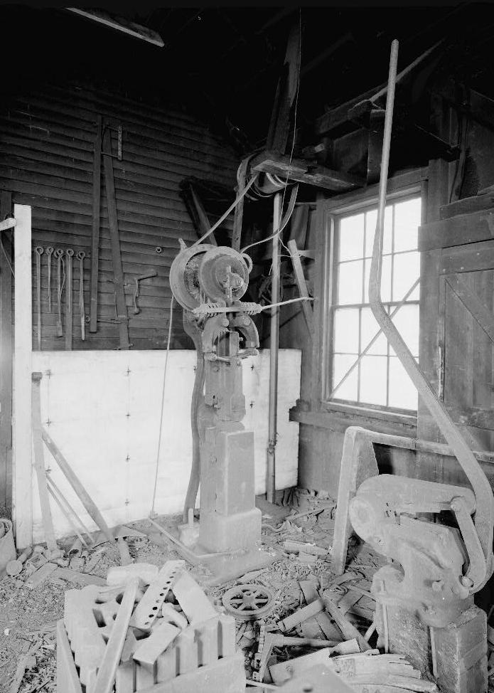 Ben Thresher's Mill, Barnet Vermont 1979 Blacksmith Shop (first floor): view looking north; trip hammer and coal bin in background, shears and swage block in foreground