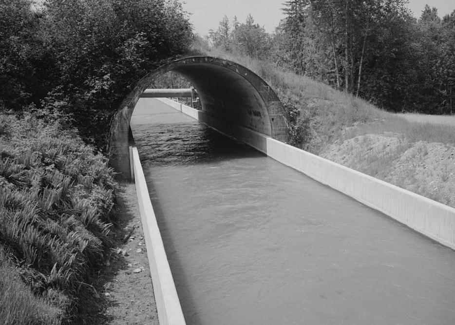 Puget Sound Power & Light Company, White River Hydroelectric Project, Dieringer Washington Concrete arch culvert constructed by Puget Sound Construction Company, 1911, for the Northern Pacific Railroad, over flume (1989)