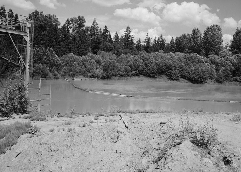 Puget Sound Power & Light Company, White River Hydroelectric Project, Dieringer Washington Log boom (downstream) protecting fish screens at Dingle Basin, looking northeast from south side of basin (1989)