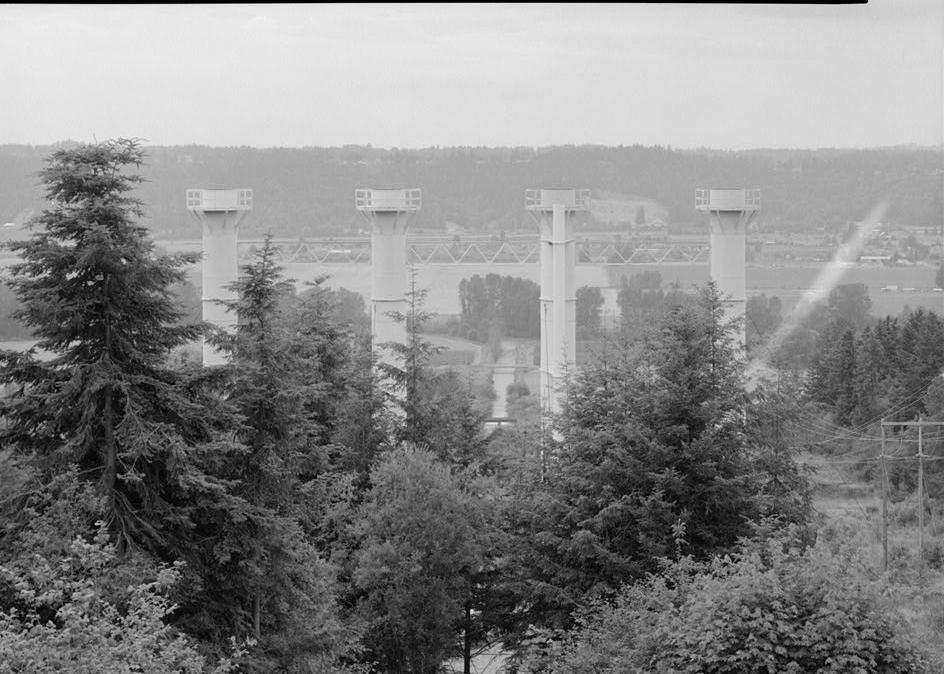 Puget Sound Power & Light Company, White River Hydroelectric Project, Dieringer Washington View of standpipes from roof of circular forebay; the channel in the center is part of the tailrace from the powerhouse; looking west (1989)