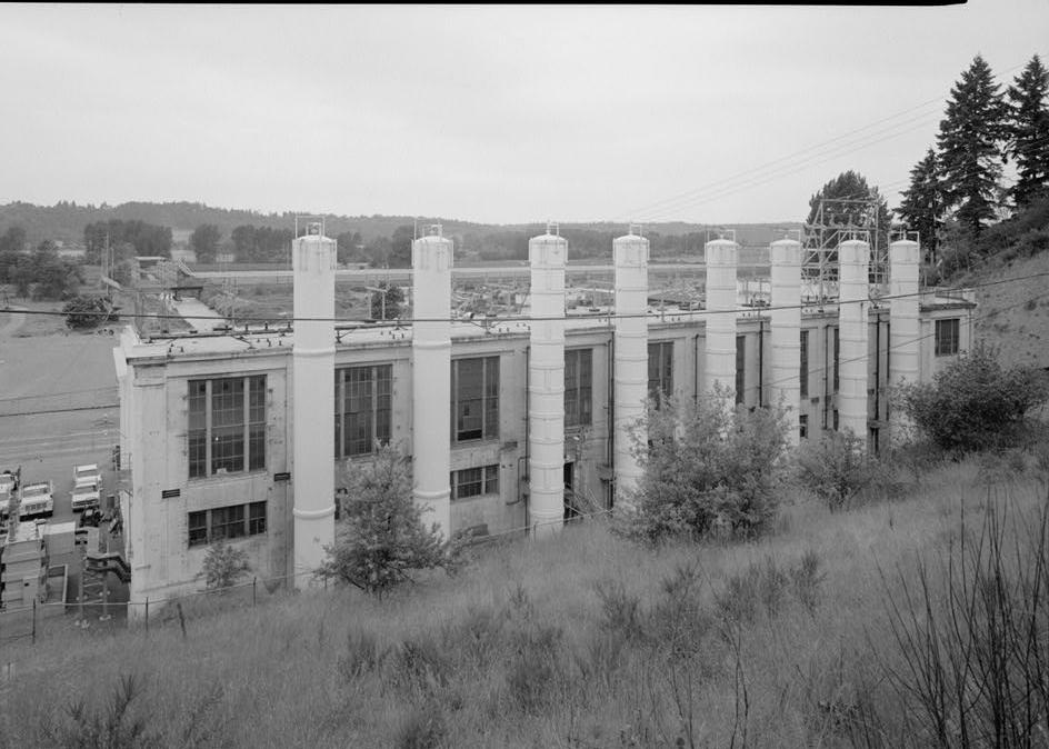 Puget Sound Power & Light Company, White River Hydroelectric Project, Dieringer Washington East facade of powerhouse; the steel tanks adjacent to the powerhouse are surge tanks; looking west (1989)
