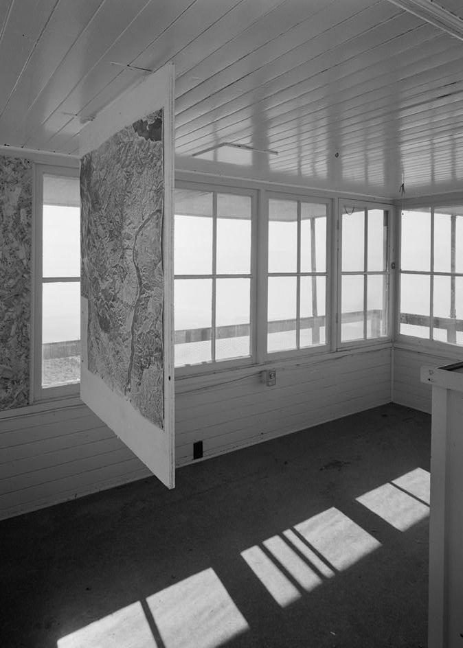 Badger Mountain Lookout Fire Watchtower, East Wenatchee Washington 1994 Interior view looking SW includes map hanging from ceiling and edge of fire finder stand on right.