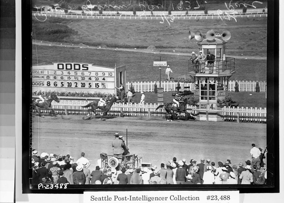Longacres Park Horse Track, Renton Washington Photocopy of photograph. (Original is No. PI-23488 in the Seattle Post-Intelligencer Collection at the Museum of History and Industry (MOHAI), Seattle, WA. A print from the original negative can be ordered from MOHAI.) A 1937 view of the finish line viewed from the grandstand. Note original timer's stand (infield steward stand), original 'tote' board, and picket fencing.