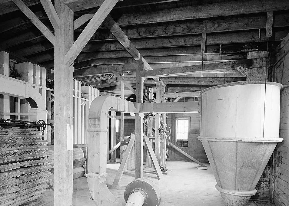 Fisher-Fallgatter Flour Mill, Waupaca Wisconsin 1979 Interior view, 3rd floor, showing Perfection Dust Collector (left) and Cyclone Dust Collector (right).