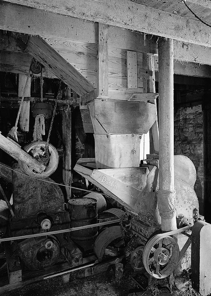 Bunker Hill Grist Mill - Cline and Chapman Roller Mill, Bunker Hill West Virginia Basement, showing Daffin Machine, an all purpose high speed grain grinding machine with steel grinding teeth (1980)