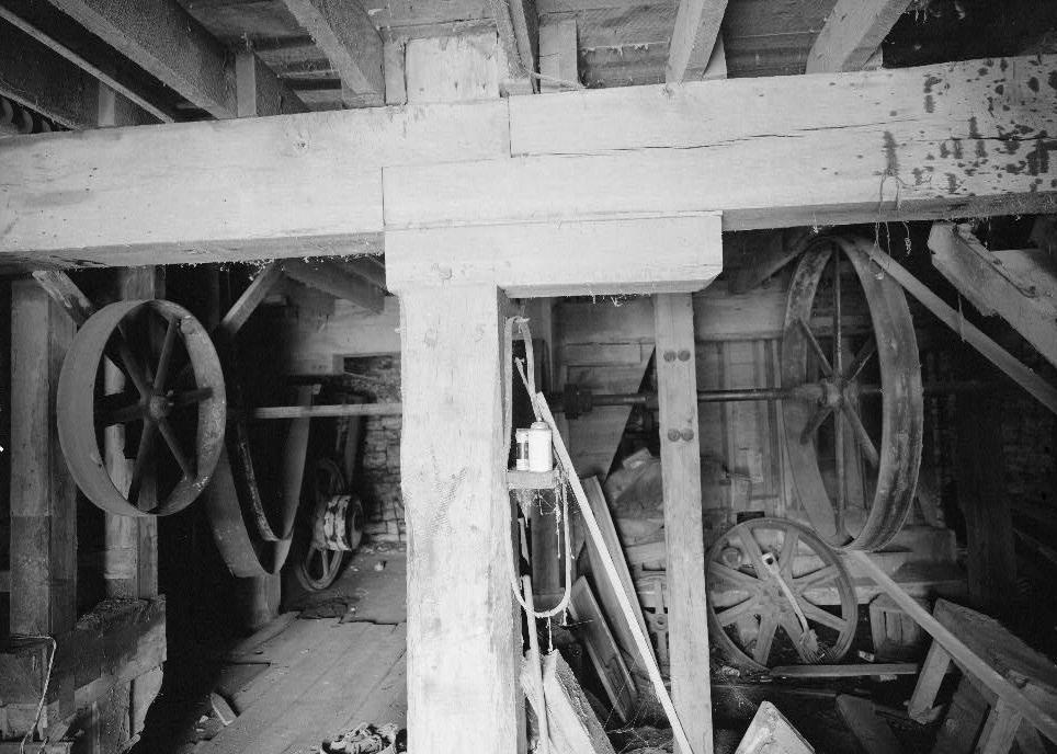 Bunker Hill Grist Mill - Cline and Chapman Roller Mill, Bunker Hill West Virginia Basement, detail of support post, bolster and lap joint wood beams (1980)