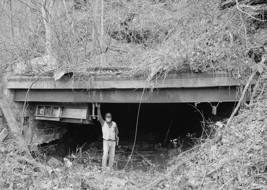 Kaymoor Coal Mine, South side of New River, Fayetteville West Virginia MINE LOCOMOTIVE ENTRANCE WITH JET LOWE SERVING AS A SCALE FIGURE (1986)