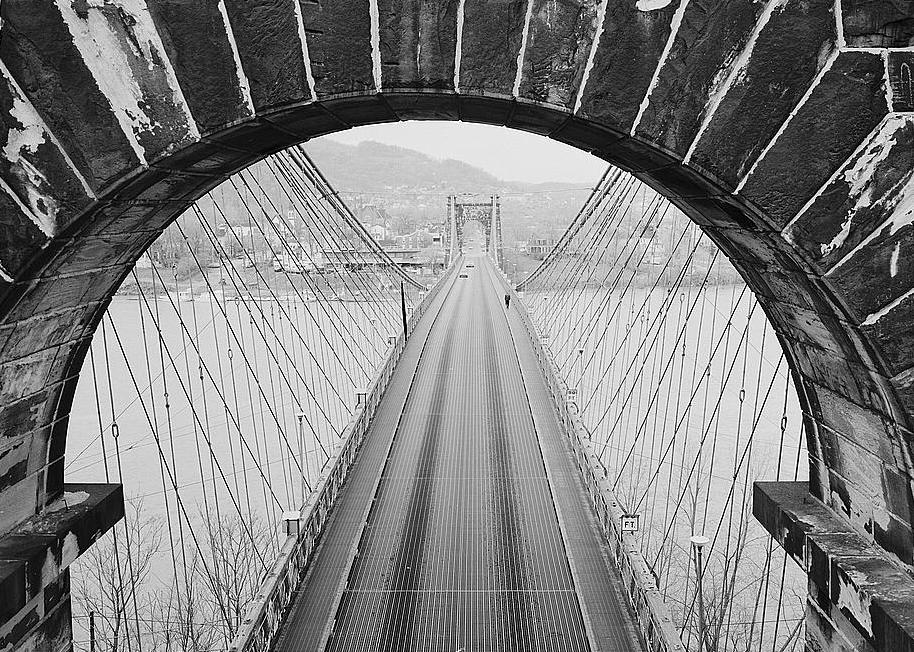 Wheeling Suspension Bridge, Wheeling West Virginia VIEW THROUGH UPPER PORTION OF EAST TOWER ARCH, LOOKING WEST AT ROADWAY AND SUSPENSION CABLES. 1977
