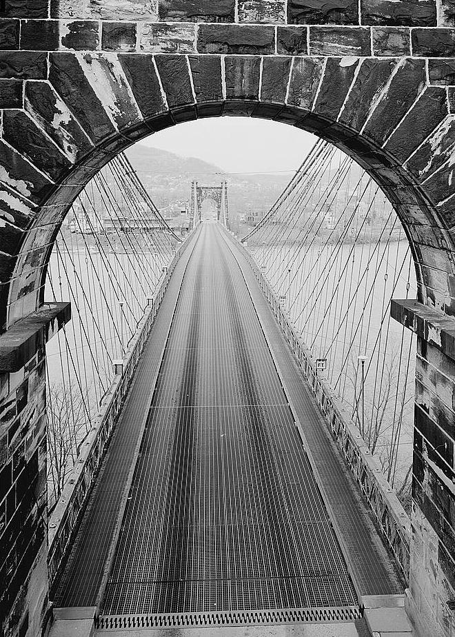 Wheeling Suspension Bridge, Wheeling West Virginia VIEW THROUGH ARCH OF EAST TOWER, LOOKING WEST AT ROADWAY AND SUSPENSION CABLES. 1977