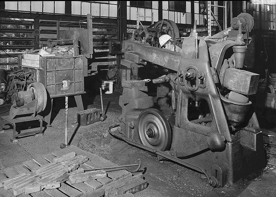 Warwood Tool Company, Wheeling West Virginia INTERIOR VIEW, WILLIAM GRAY OPERATING THE BRADLEY HAMMER, WITH UPPER IMPRESSION DIE RAISED READY TO FORGE TOOL 1990
